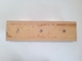 Contre lame de godet centrale reversible 3 trous en 1 1/4